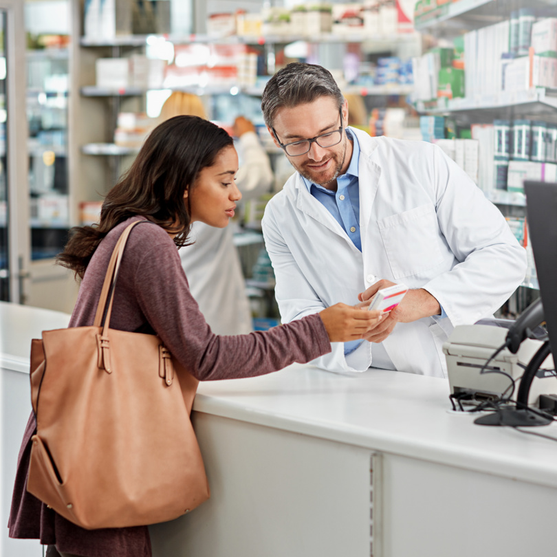 A woman is shopping at a pharmacy.