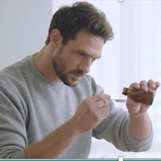 Man measuring his medicine
