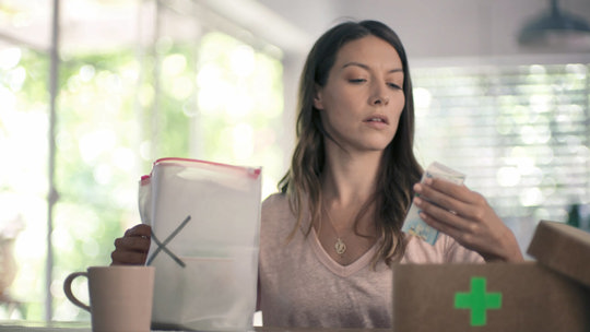 woman checking medicine expiry thumbnail