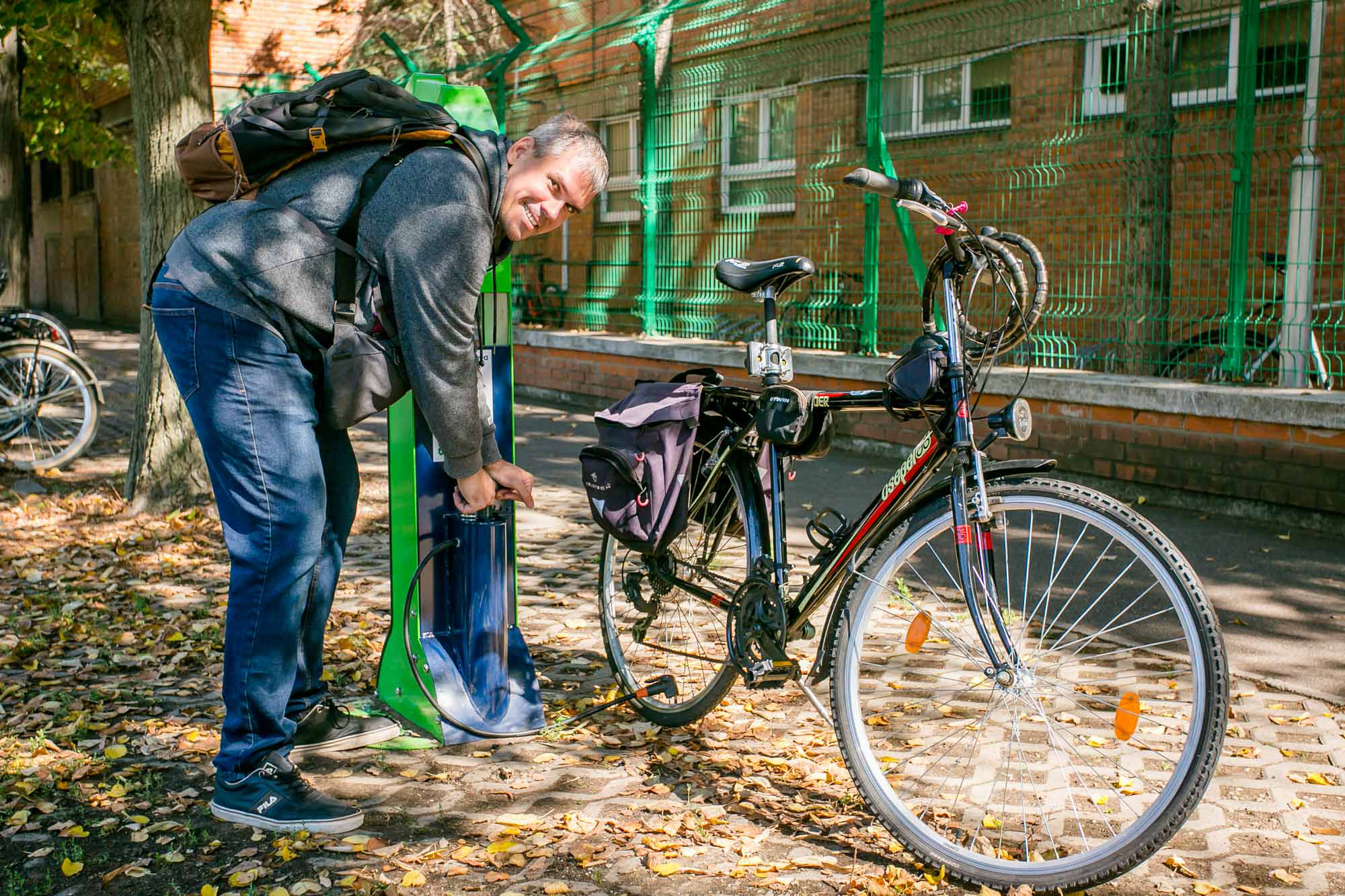 Man pumping bike tire