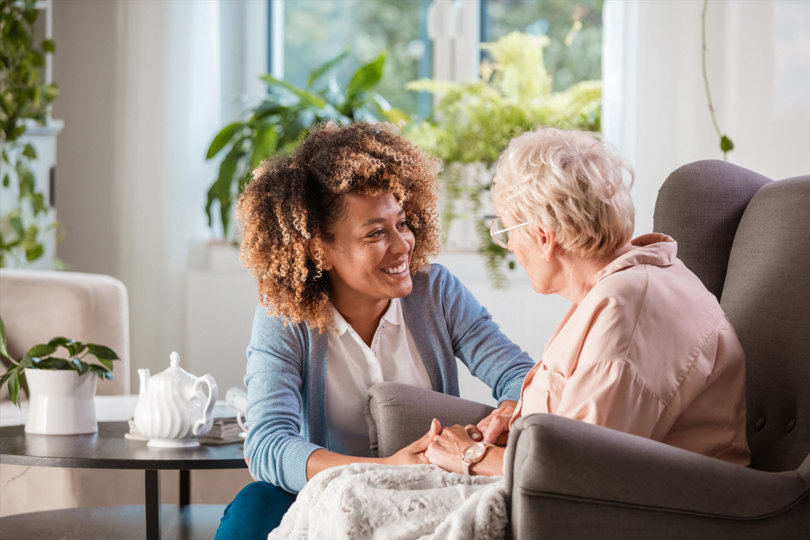 Woman caring for elder woman