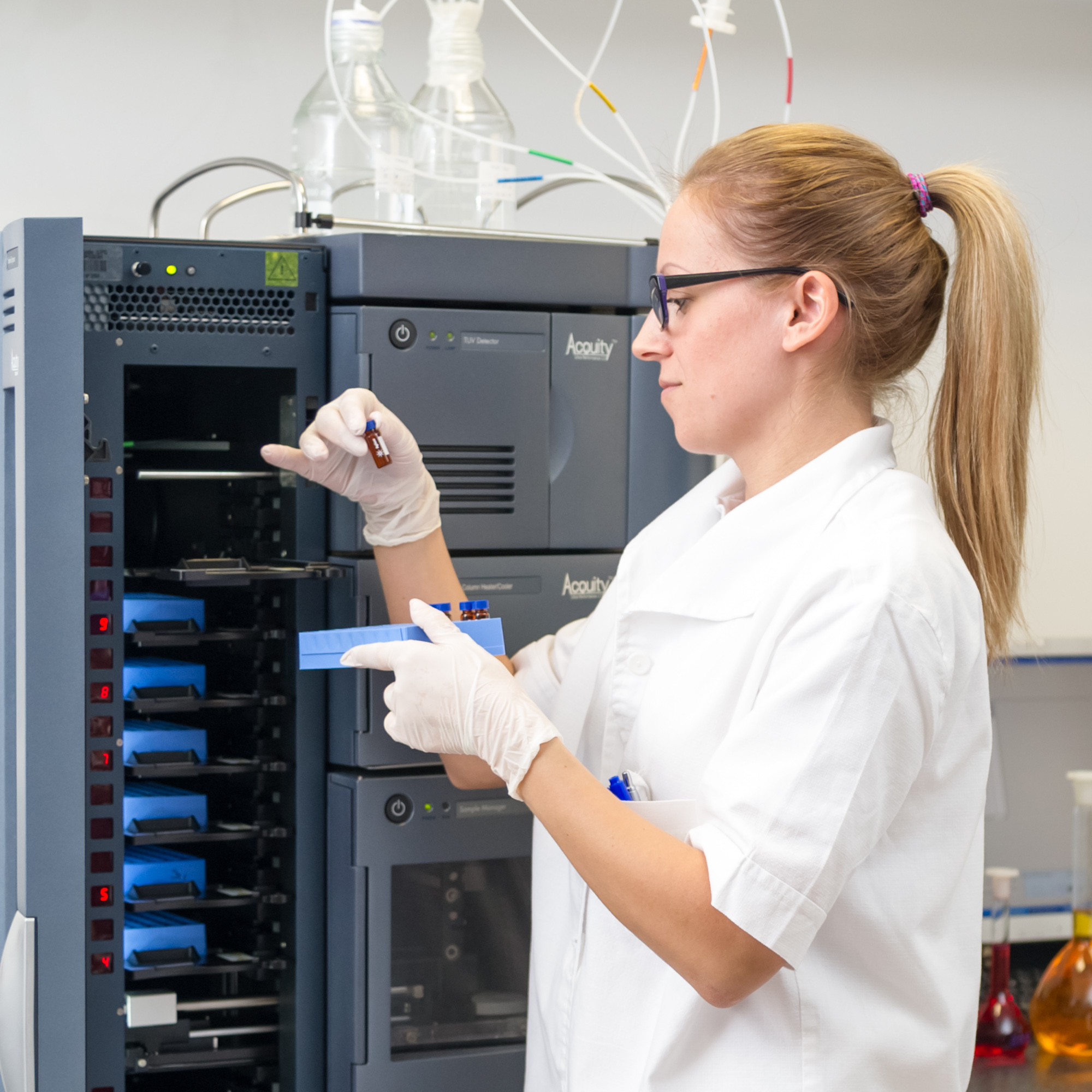 Pharmacist checking test tube