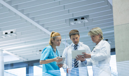 Two doctors and a nurse talking