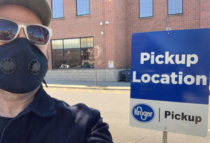 A man with a mask at a pickup location
