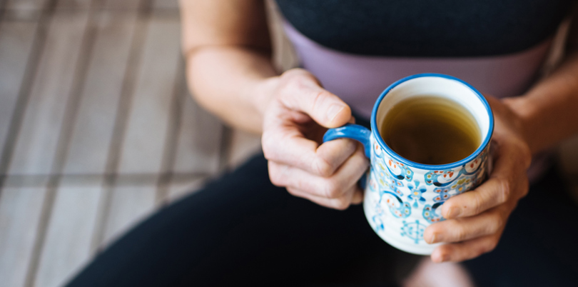 drinking coffee on the couch