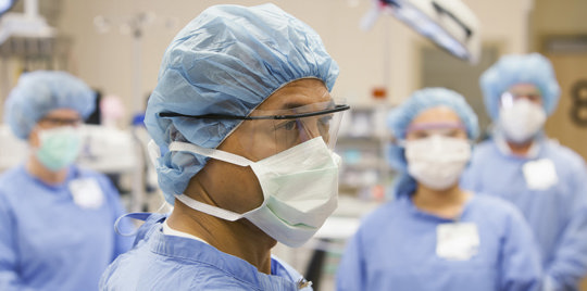  people with protective masks on their faces