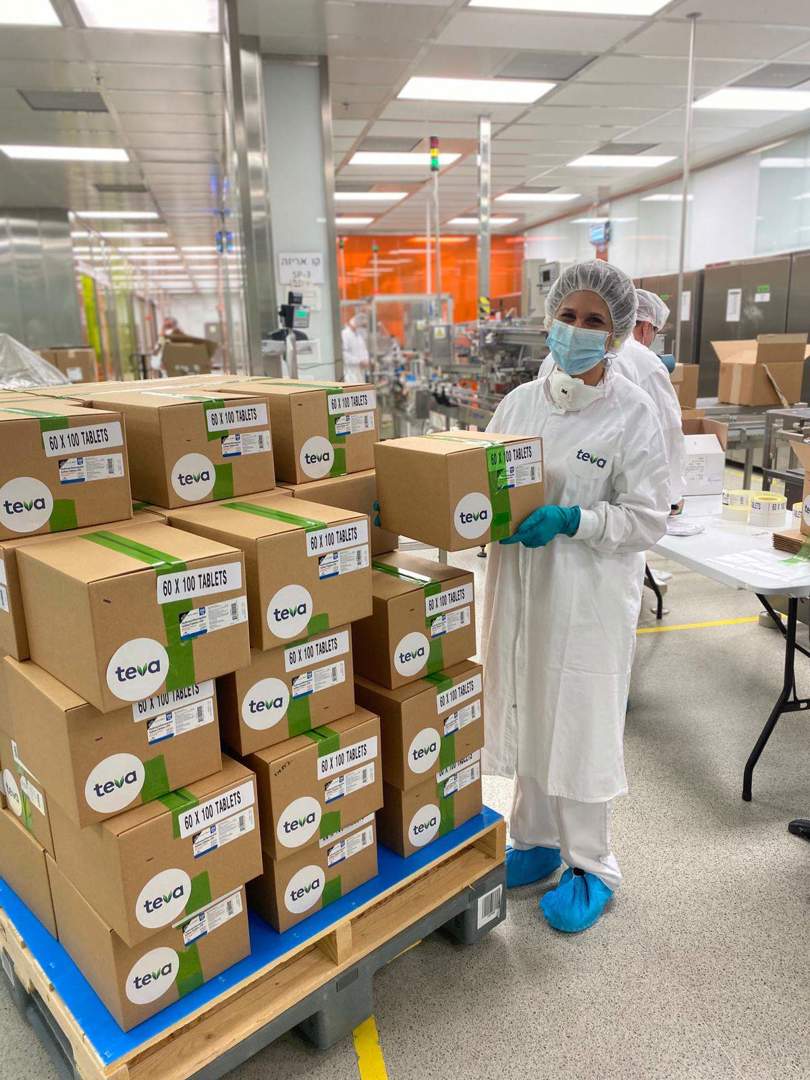 Woman holding box in the warehouse