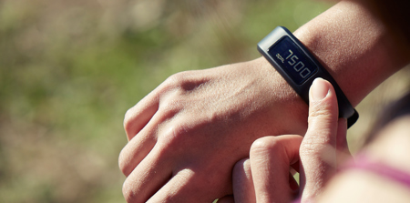 A person using their fitness tracker