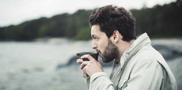 Man drinking at the beach