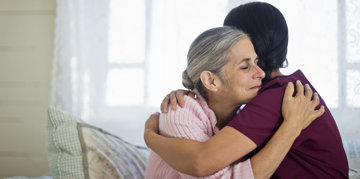 nurse hugging patient woman
