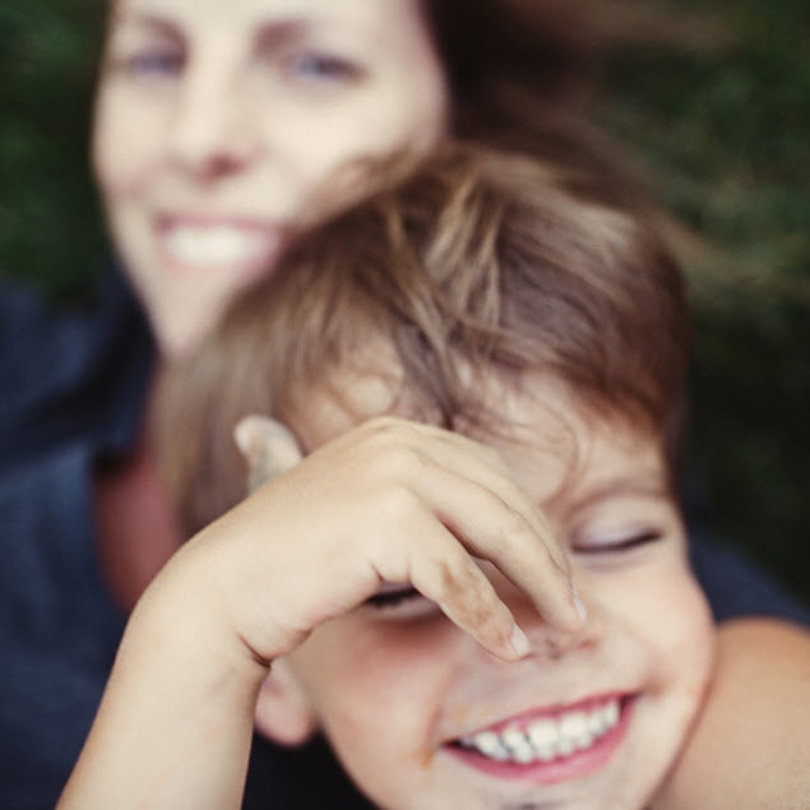 Child laughing with mother