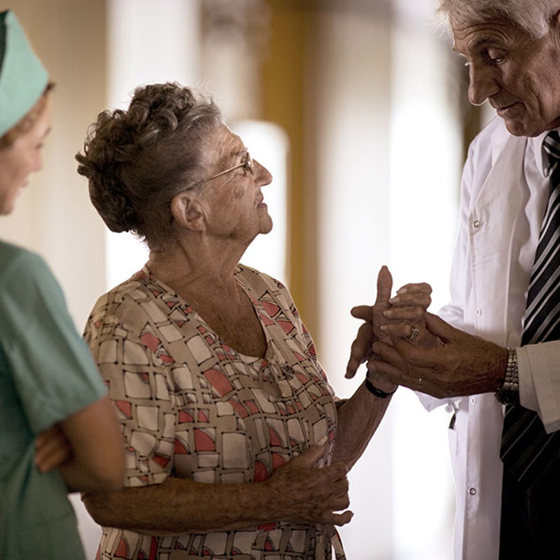 Doctor and nurse speaking with patient
