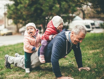 Man with kids on his back