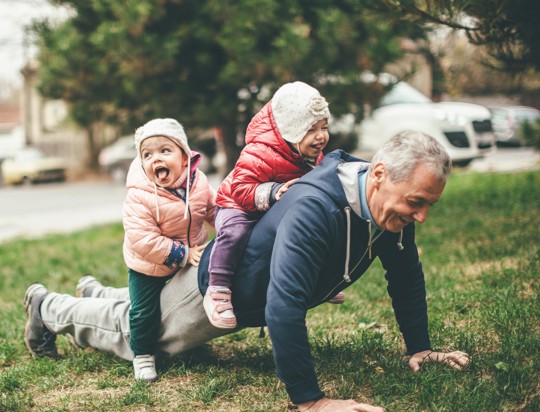 Man with kids on his back