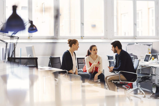 People sitting and talking in an office