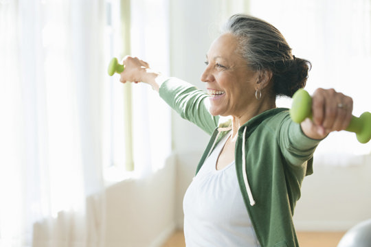 Older woman exercising with dumbels