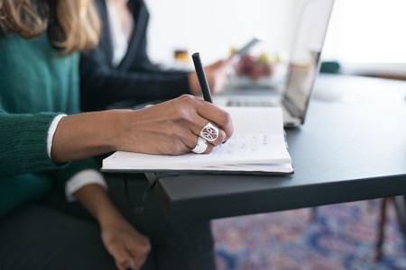 Woman writing in her notebook