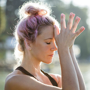 Woman holding her head