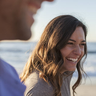 Woman smiling at the beach