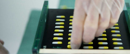 sorting yellow and white pills