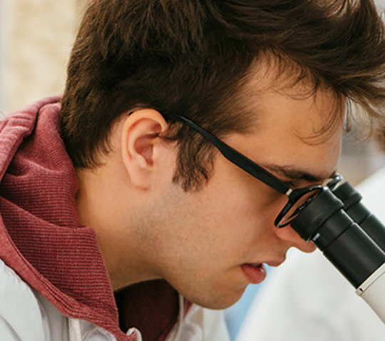 Man using a microscope