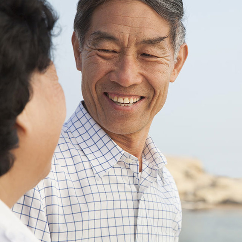 A man smiling towards his wife