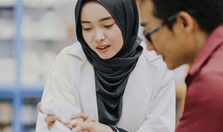woman and man holding medicines woman and man holding medicines