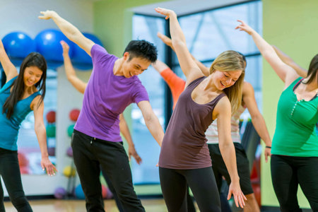 Woman enjoys a group exercise class despite living with asthma